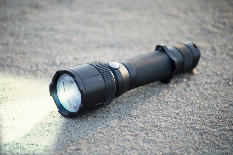 Pocket LED Flashlight on the Ground