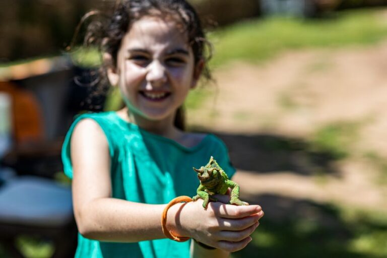 Little Girl Holding a Chameleon